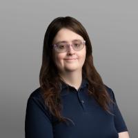 Faye Rabidoux - Headshot, Grey Background